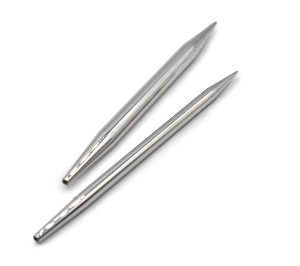 Two metal knitting needles on a white background