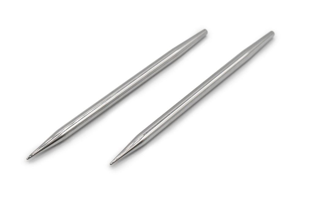Two metallic knitting needles on a white background